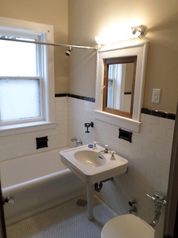 1011 Hull Terrace, Unit 22 Evanston, IL 60202 - Photo 5 of 10 a bathroom with a sink and a mirror