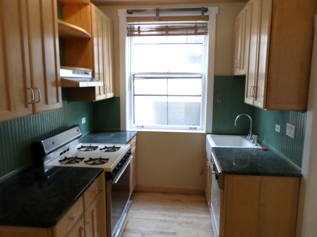 1011 Hull Terrace, Unit 22 Evanston, IL 60202 - Photo 9 of 10 a kitchen that has a sink and a stove