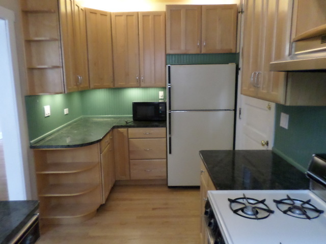 1011 Hull Terrace, Unit 22 Evanston, IL 60202 - Photo 10 of 10 a kitchen with a stove and a refrigerator