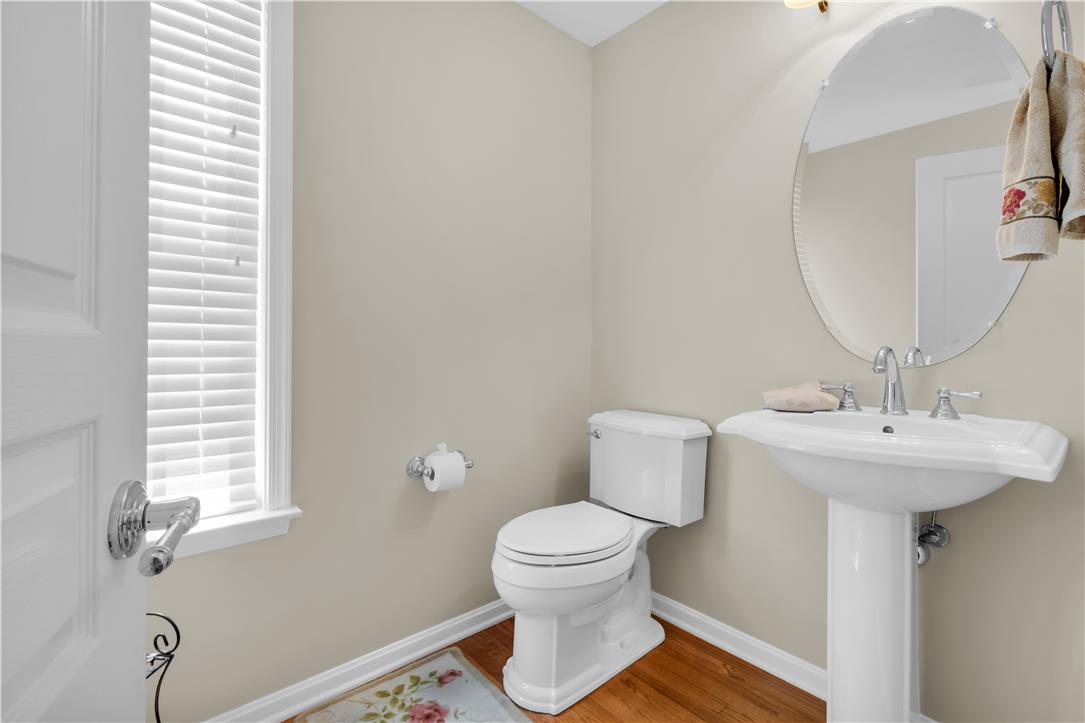 1709 Travers Road Breinigsville, PA 18031 - Photo 23 of 55 A well-appointed bathroom with a classic pedestal sink and ample natural light from the window.