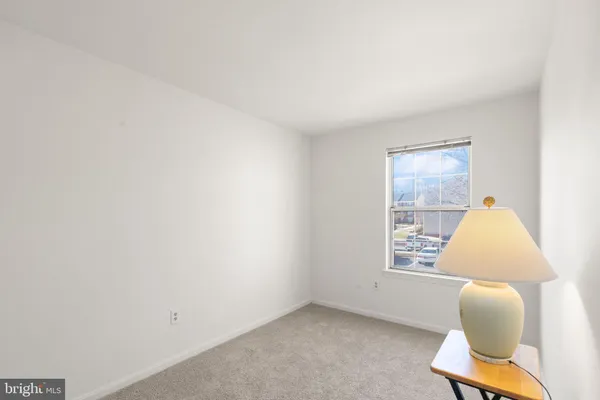a view of room with window and lounge chair