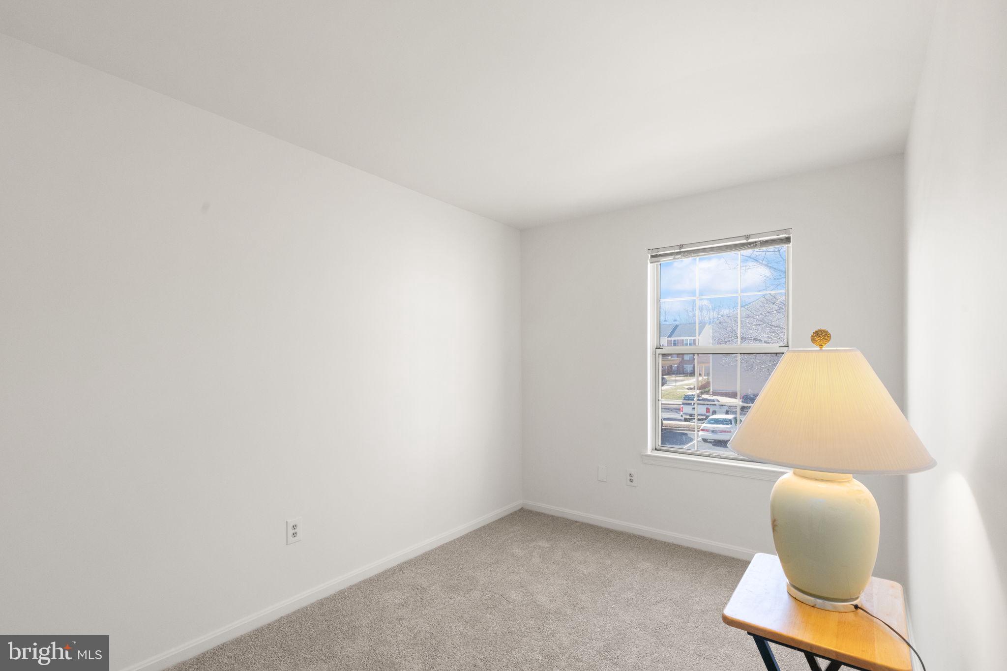 2407 Normandy Square Place, Unit C Silver Spring, MD 20906 - Photo 16 of 19 a view of room with window and lounge chair