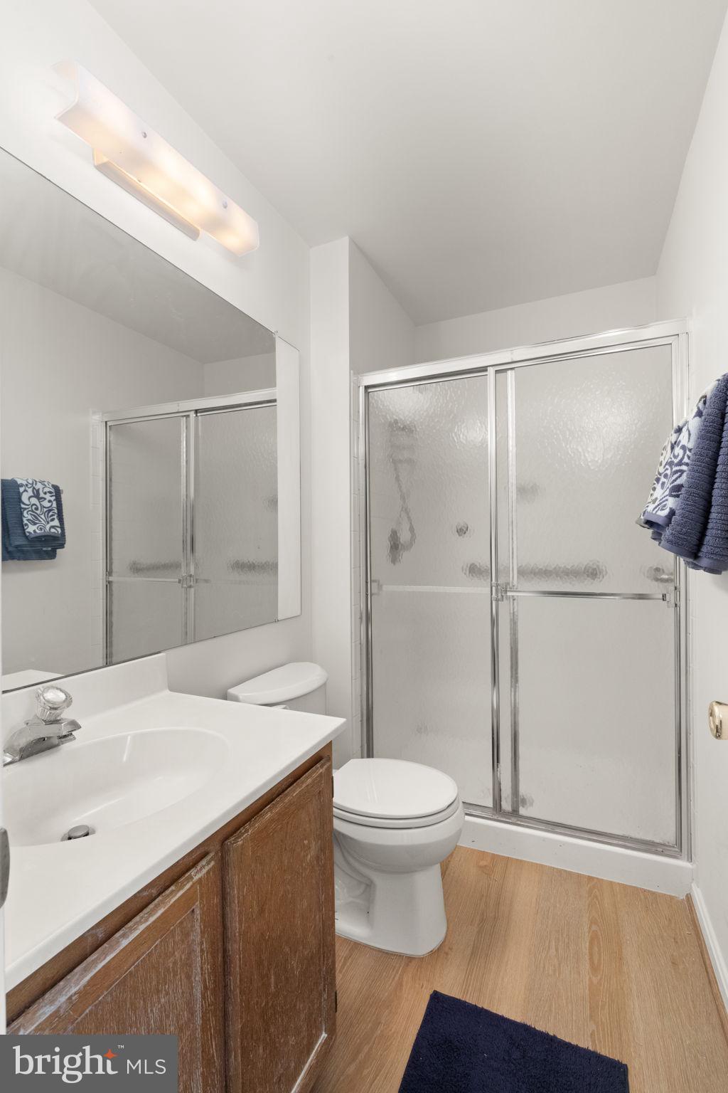 2407 Normandy Square Place, Unit C Silver Spring, MD 20906 - Photo 19 of 19 a bathroom with a sink a toilet and shower