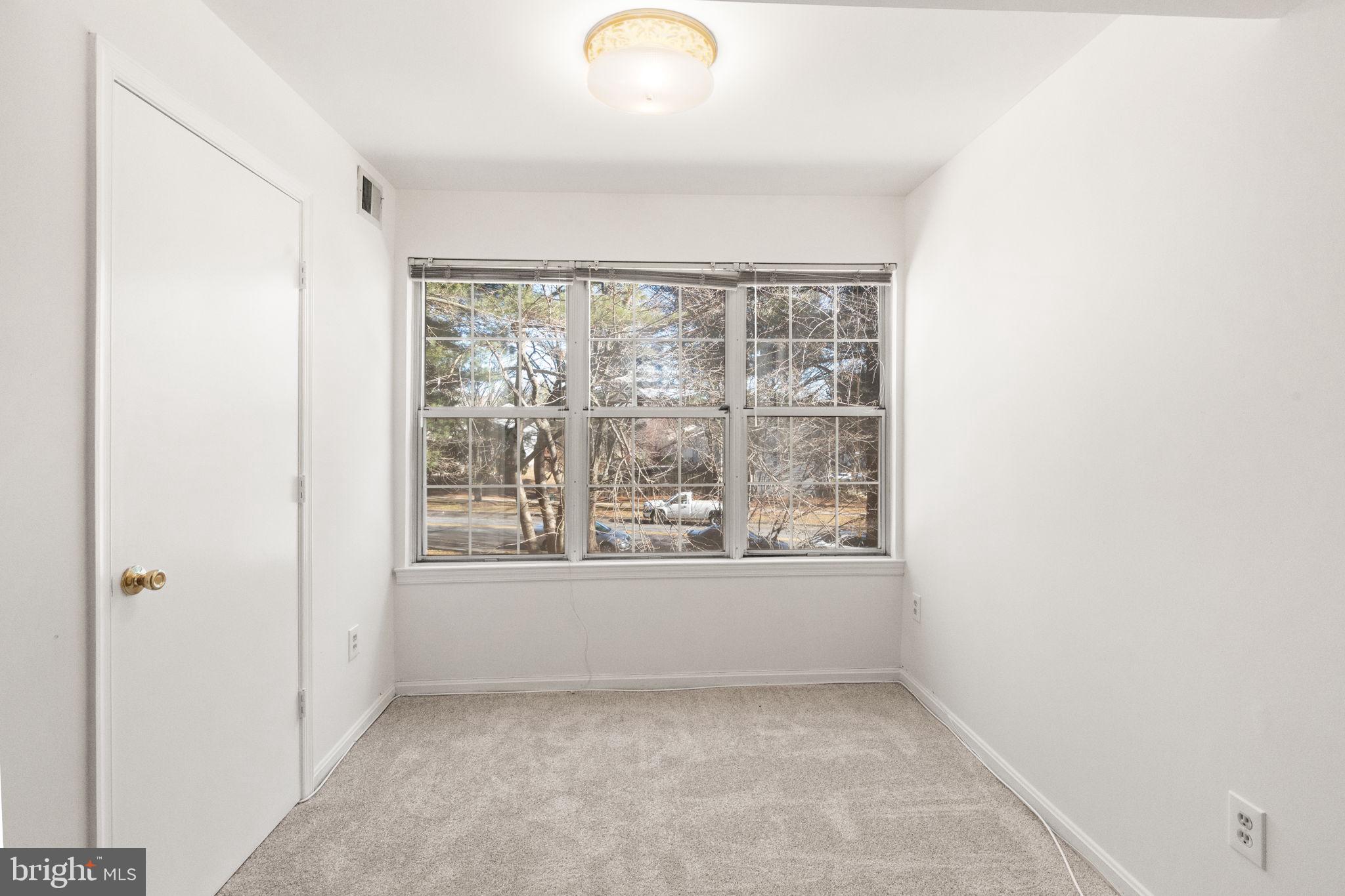 2407 Normandy Square Place, Unit C Silver Spring, MD 20906 - Photo 6 of 19 an empty room with a window