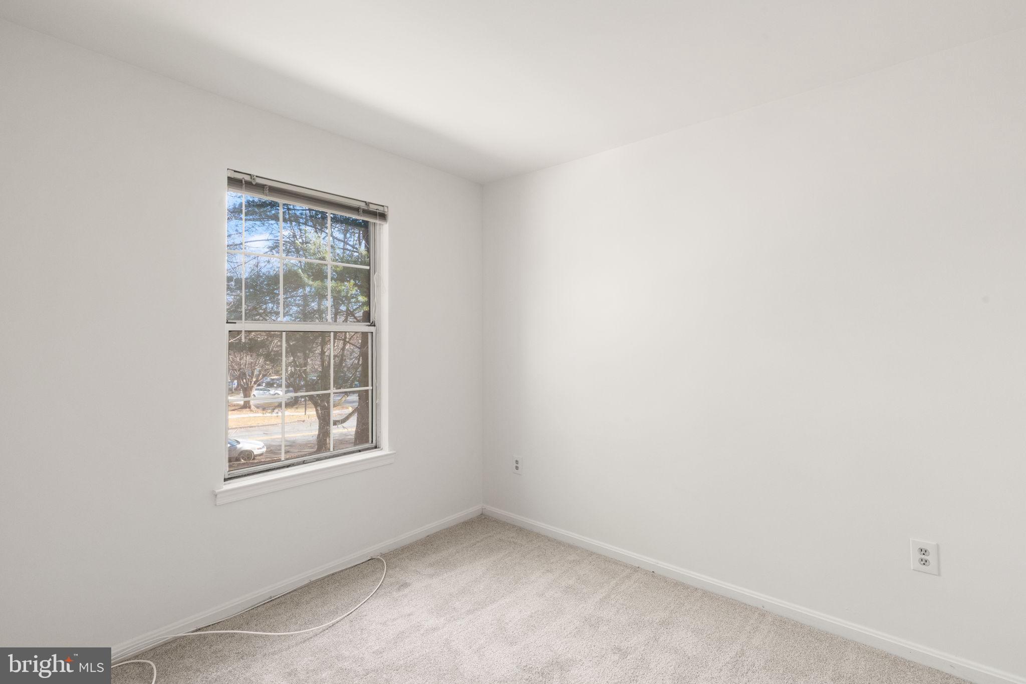 2407 Normandy Square Place, Unit C Silver Spring, MD 20906 - Photo 7 of 19 an empty room with a window