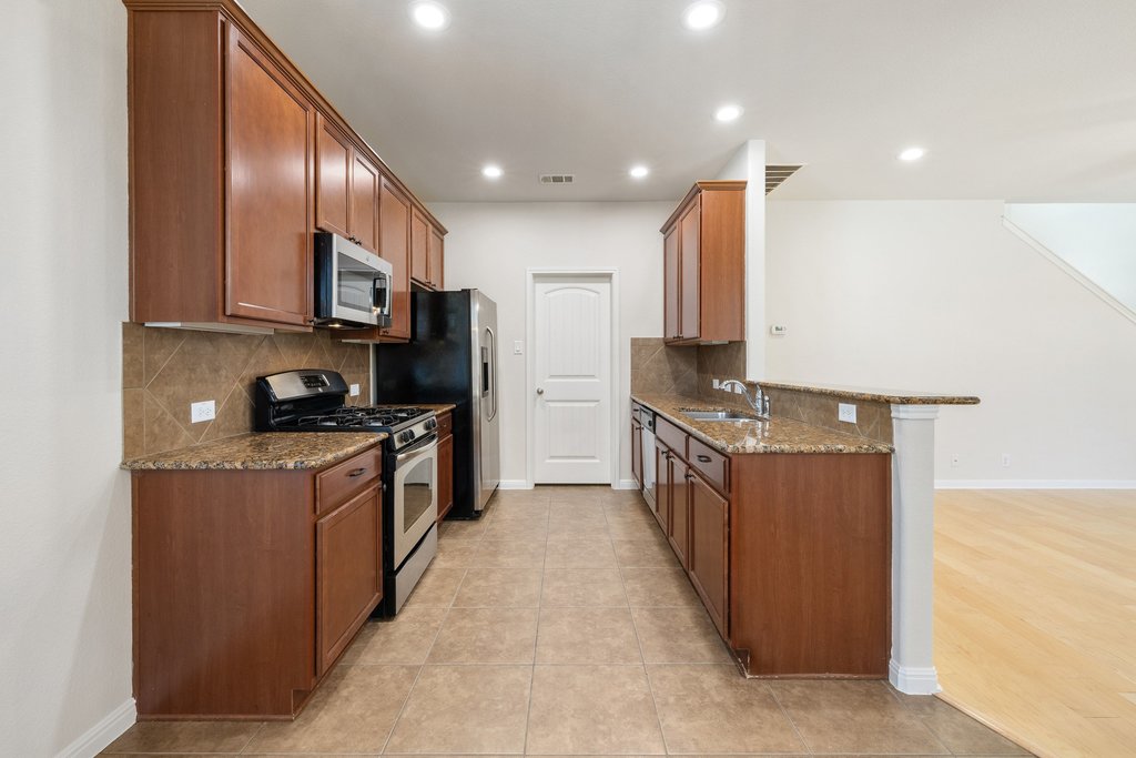 9412 Beechnut Drive Austin, TX 78748 - Photo 13 of 40 Functional kitchen with ample storage and great countertop space.