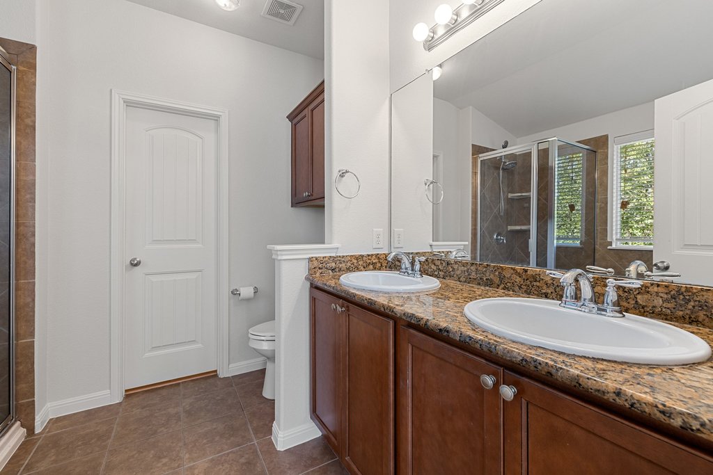 9412 Beechnut Drive Austin, TX 78748 - Photo 21 of 40 Primary bath: Double vanity, walk-in shower and garden tub with large closet