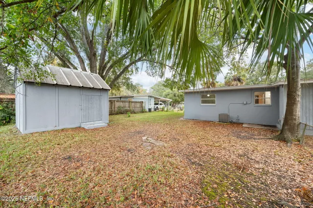 a backyard of a house with lots of green space