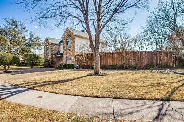 a house with trees in front of it