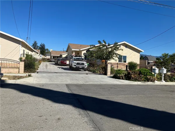 a view of a house with a street