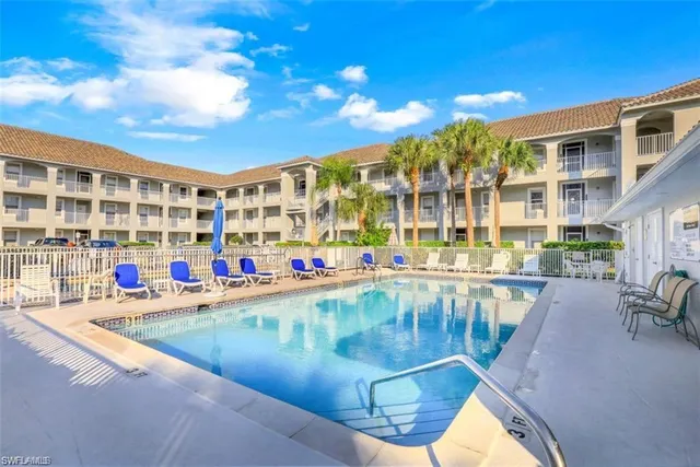 a view of a swimming pool with a patio
