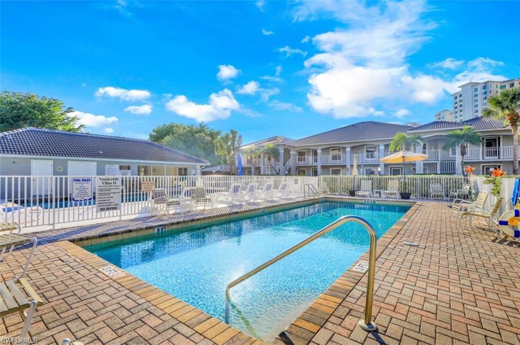 519 Roma Court, Unit 3301 Naples, FL 34110 - Photo 13 of 14 a view of a swimming pool with a patio
