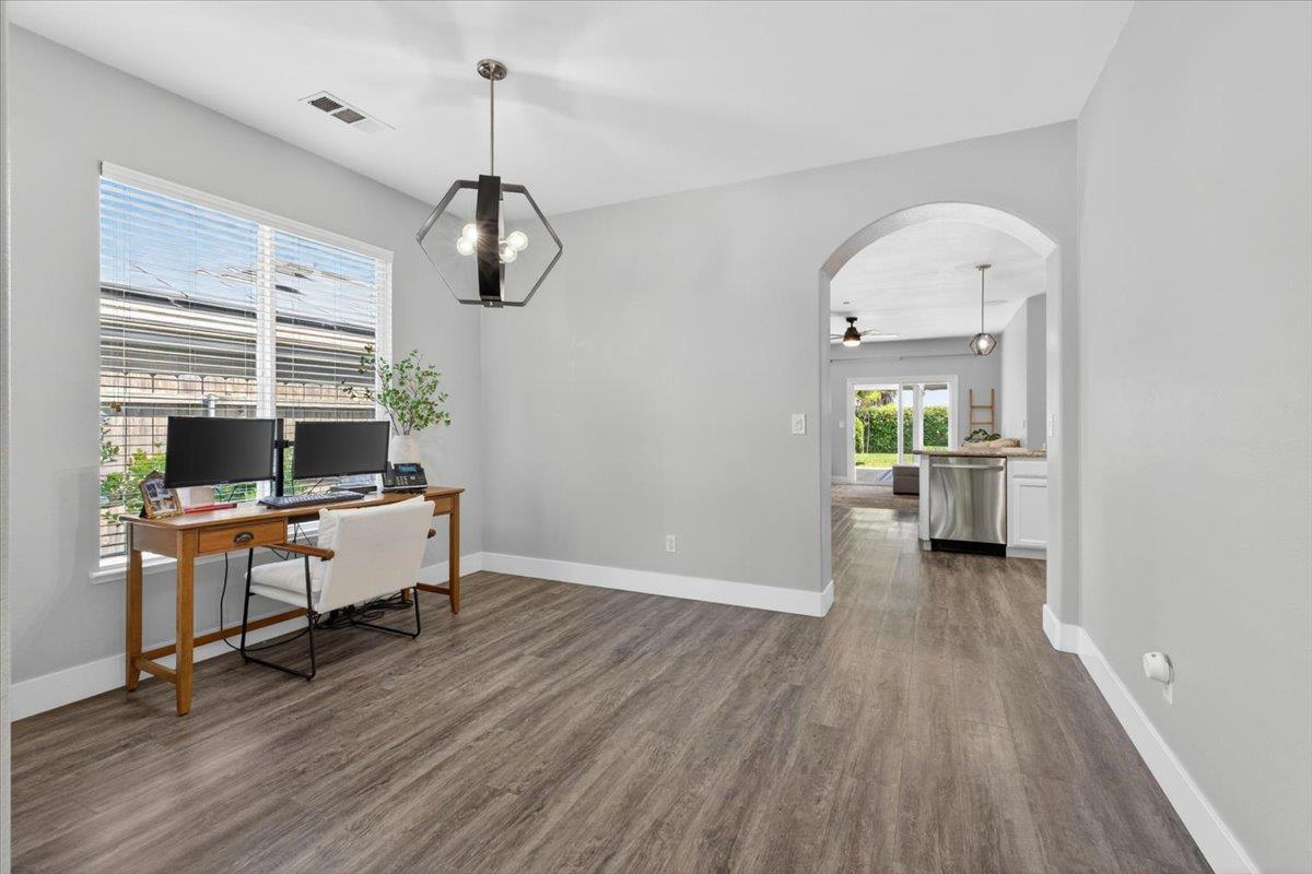 437 Silver Ridge Court Oakdale, CA 95361 - Photo 8 of 41 a view of a workspace with wooden floor