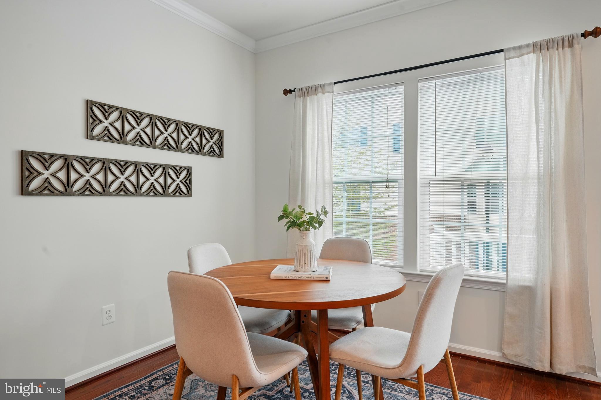 7054 Kona Drive Gainesville, VA 20155 - Photo 14 of 39 a view of a dining room with furniture window and wooden floor