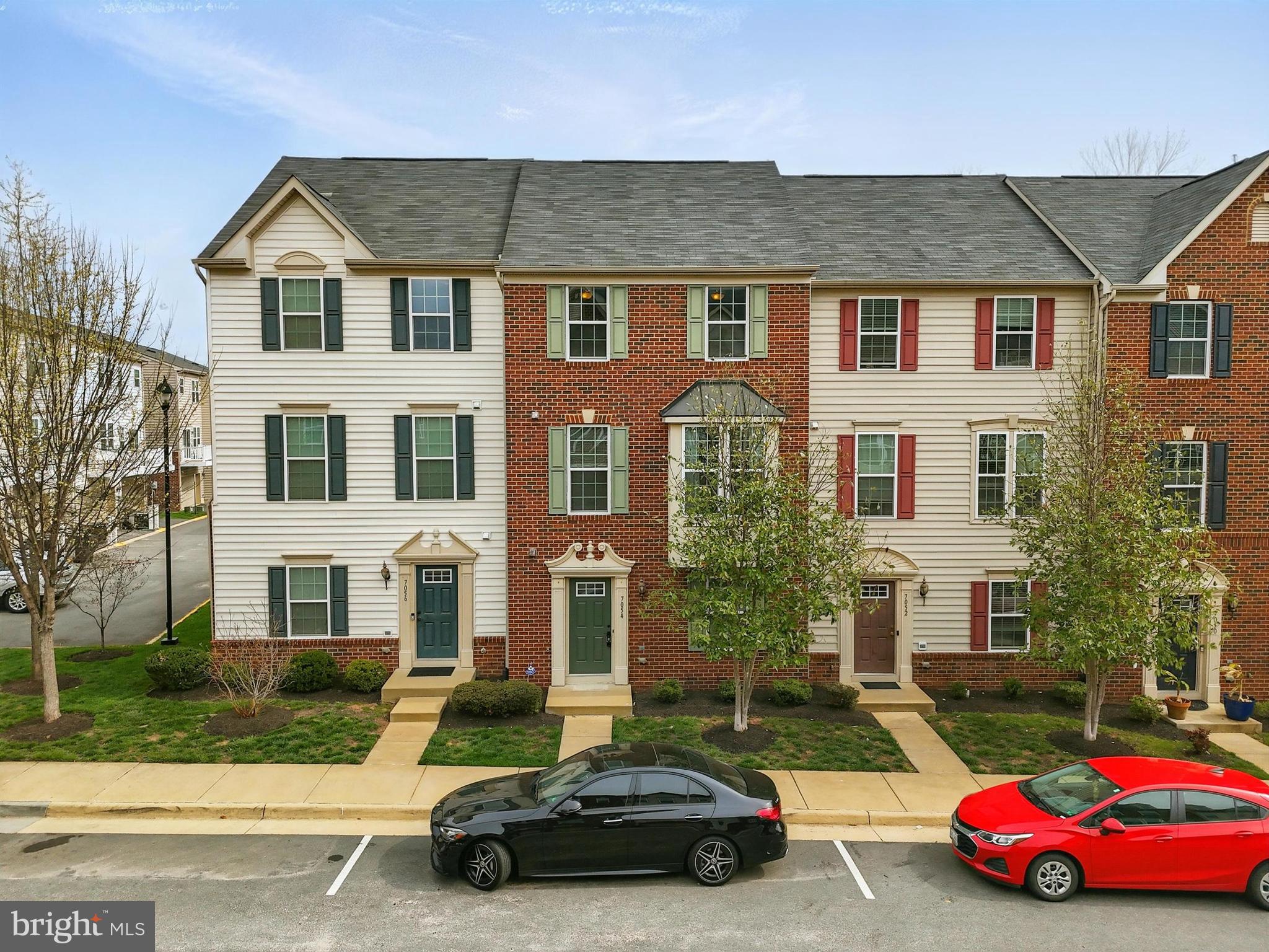 7054 Kona Drive Gainesville, VA 20155 - Photo 2 of 39 a car parked in front of a house