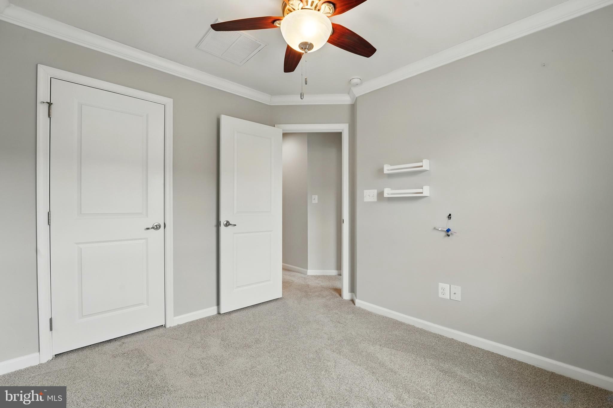 7054 Kona Drive Gainesville, VA 20155 - Photo 27 of 39 an empty room with chandelier fan