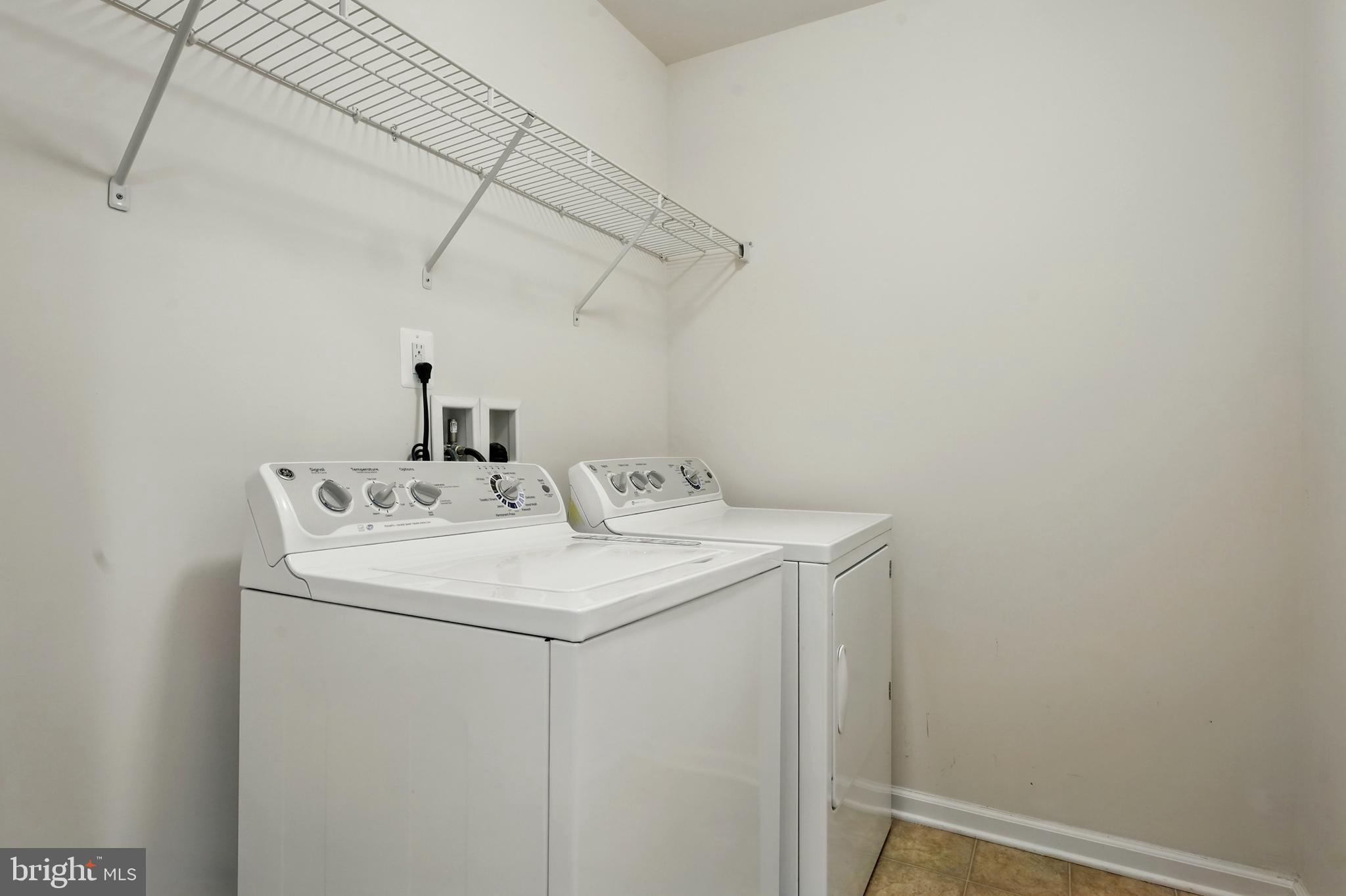 7054 Kona Drive Gainesville, VA 20155 - Photo 28 of 39 a utility room with dryer and washer
