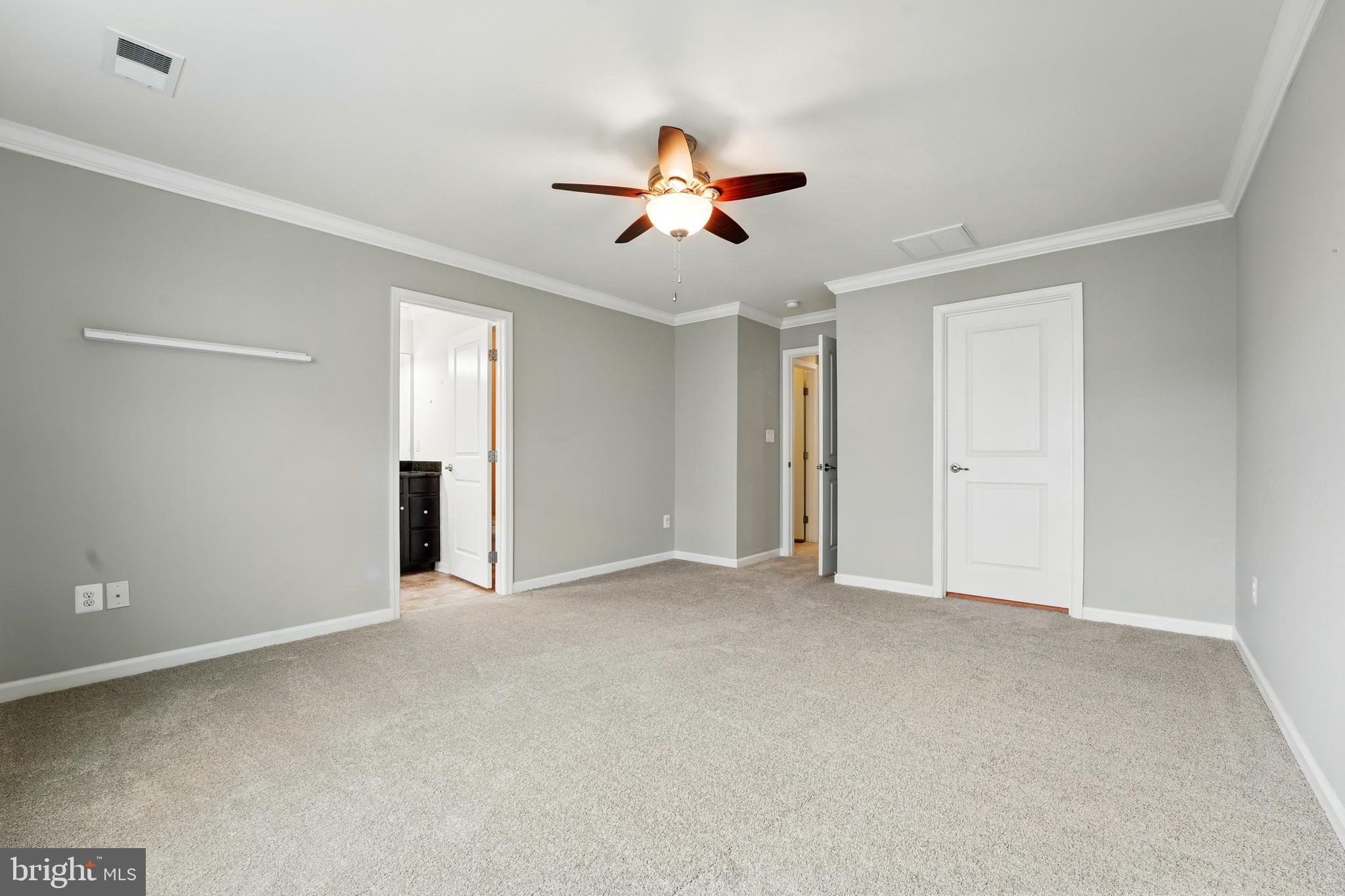 7054 Kona Drive Gainesville, VA 20155 - Photo 30 of 39 a view of an empty room with a ceiling fan