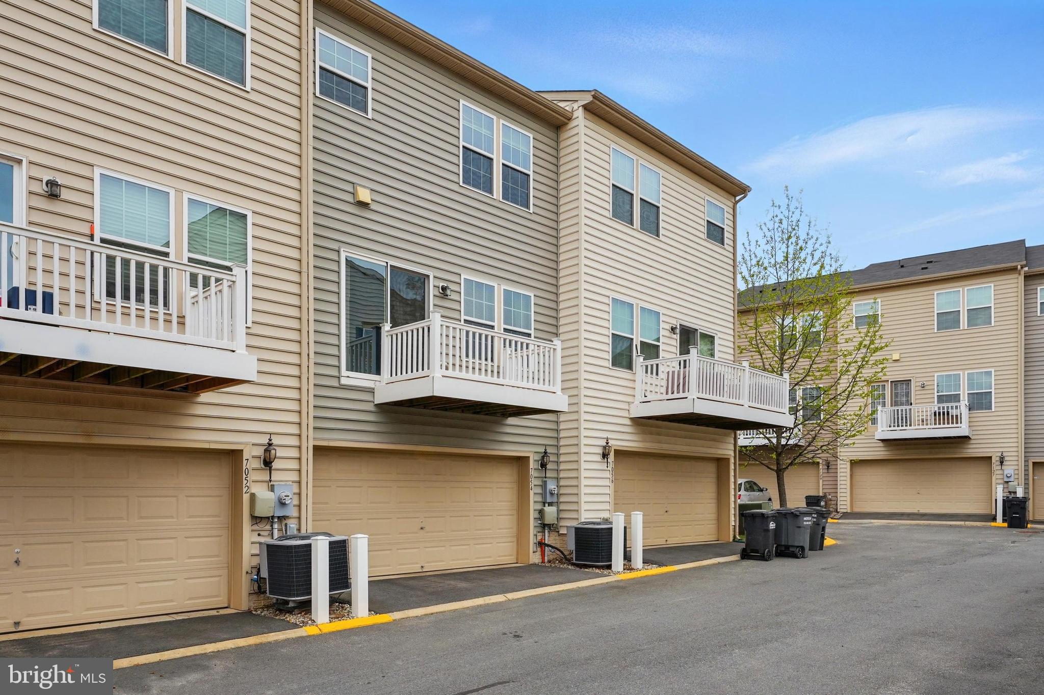 7054 Kona Drive Gainesville, VA 20155 - Photo 34 of 39 a front view of a house with a road