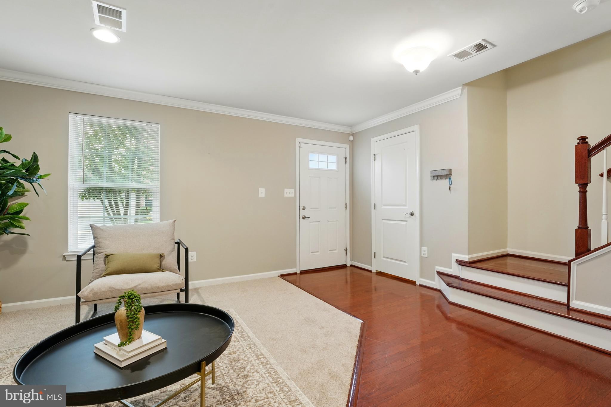 7054 Kona Drive Gainesville, VA 20155 - Photo 8 of 39 a living room with furniture and a table