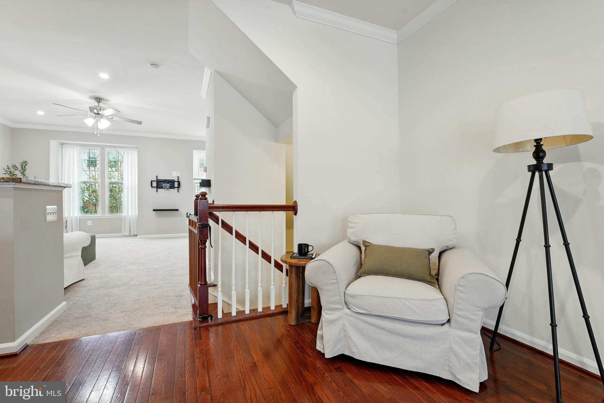 7054 Kona Drive Gainesville, VA 20155 - Photo 10 of 39 a living room with furniture and a wooden floor