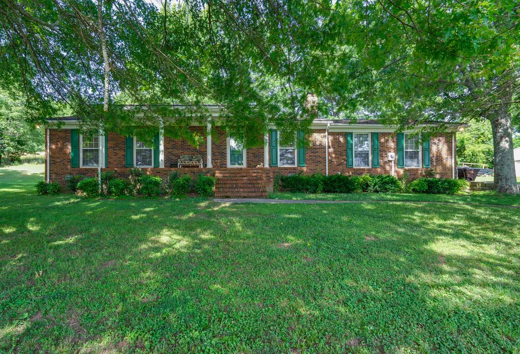 All brick, carport, garage and shop!