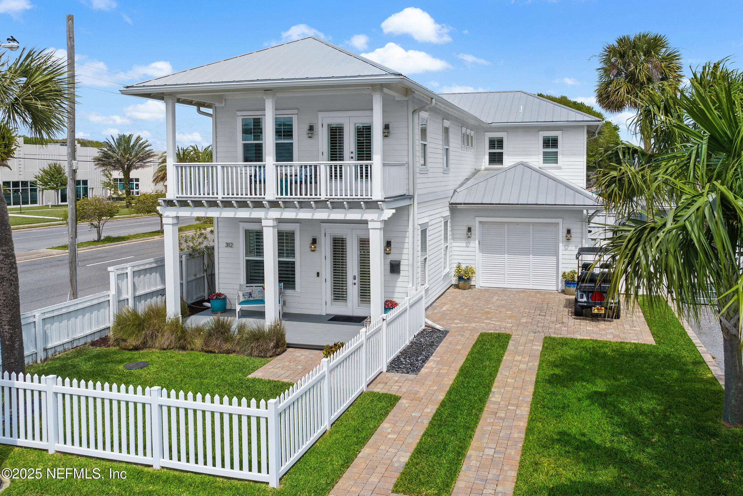 a front view of a house with a yard table and chairs