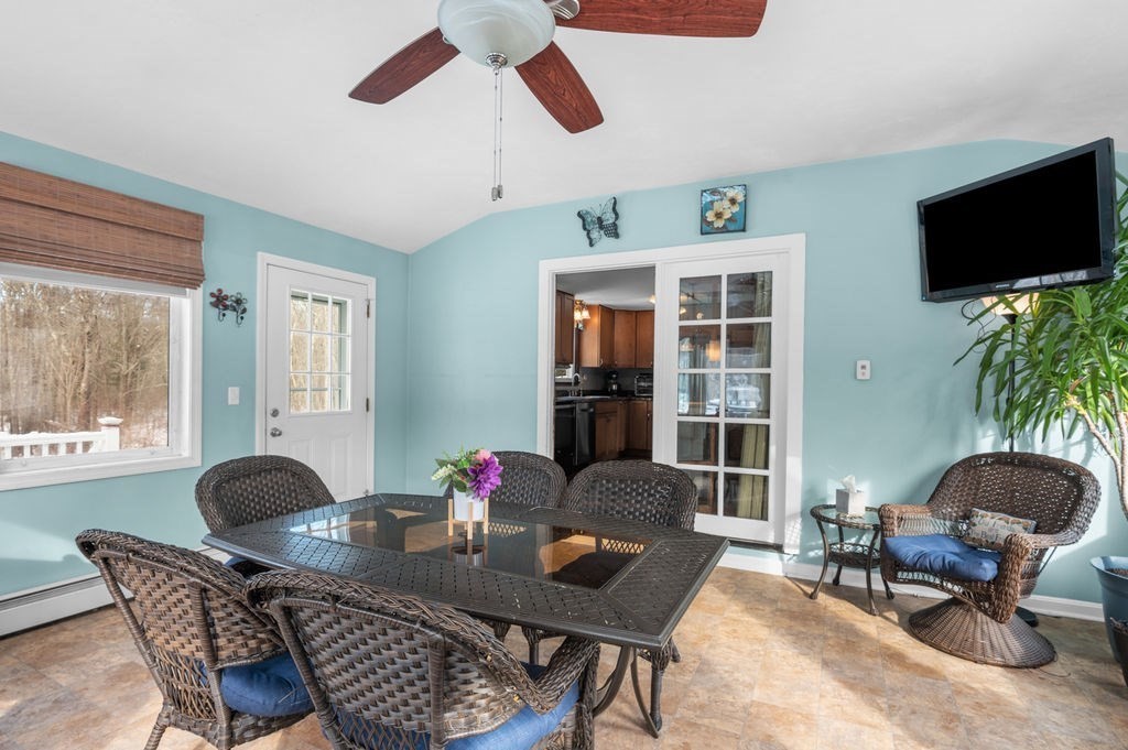 53 Birch Meadow Road Merrimac, MA 01860 - Photo 11 of 38 a living room with furniture and a flat screen tv