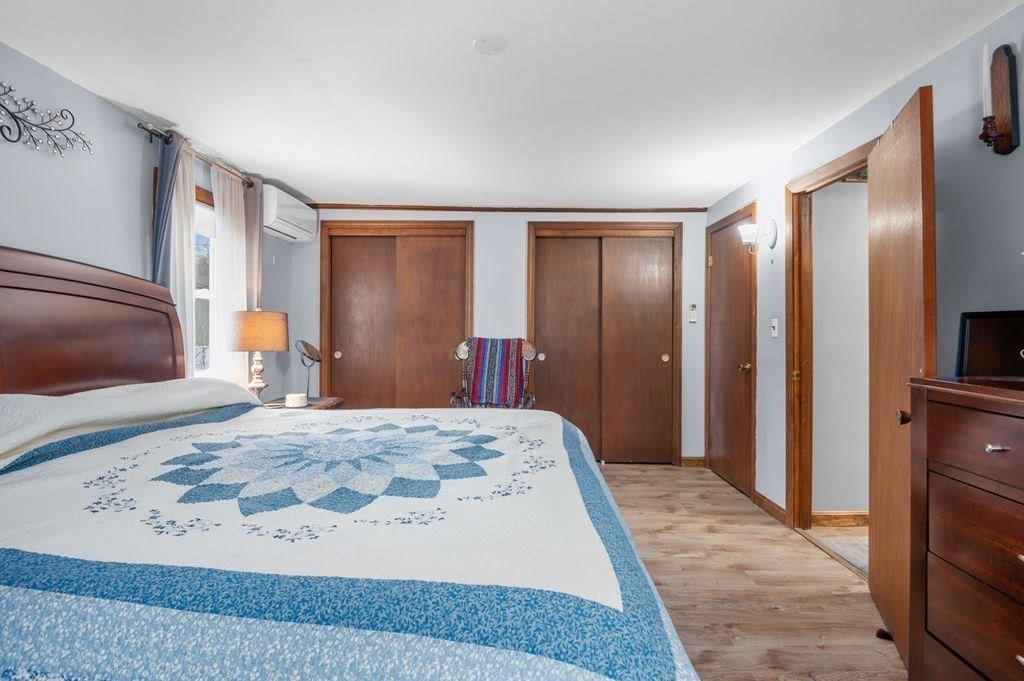 53 Birch Meadow Road Merrimac, MA 01860 - Photo 19 of 38 a bedroom with a large bed and a couch