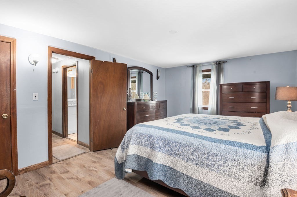 53 Birch Meadow Road Merrimac, MA 01860 - Photo 20 of 38 a bedroom with a bed and a dresser