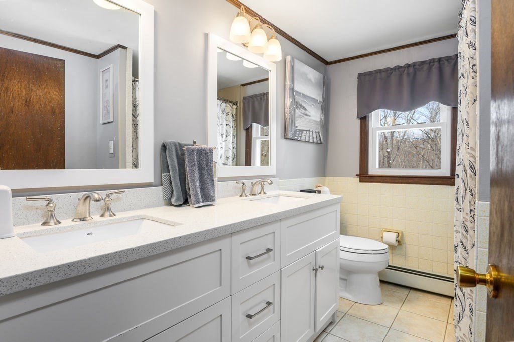53 Birch Meadow Road Merrimac, MA 01860 - Photo 25 of 38 a bathroom with a granite countertop sink mirror and a toilet