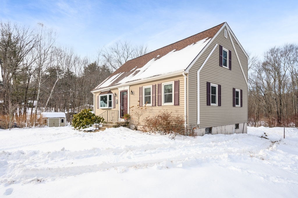 53 Birch Meadow Road Merrimac, MA 01860 - Photo 26 of 38 a front view of a house with a yard covered in snow