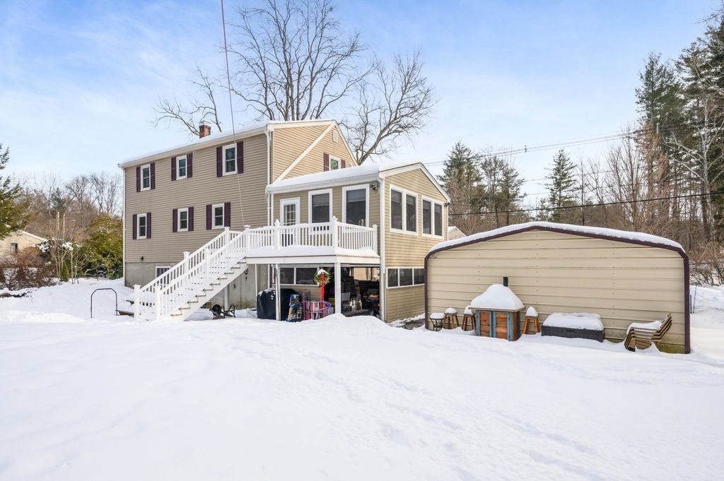 53 Birch Meadow Road Merrimac, MA 01860 - Photo 27 of 38 a view of a white house with a large trees next to a road