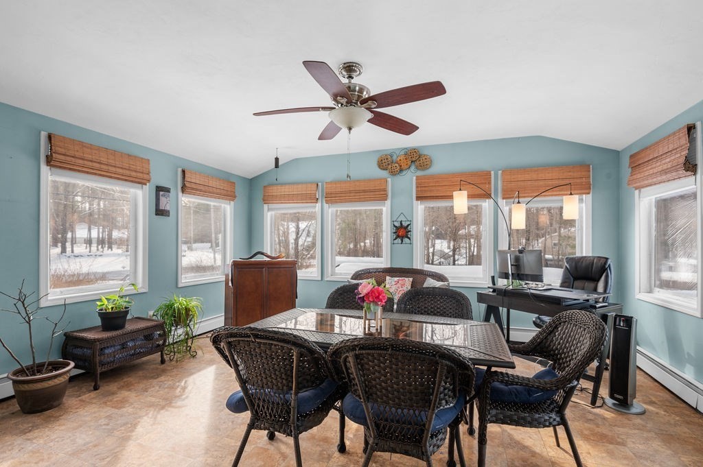 53 Birch Meadow Road Merrimac, MA 01860 - Photo 10 of 38 a dining room with furniture a chandelier and wooden floor