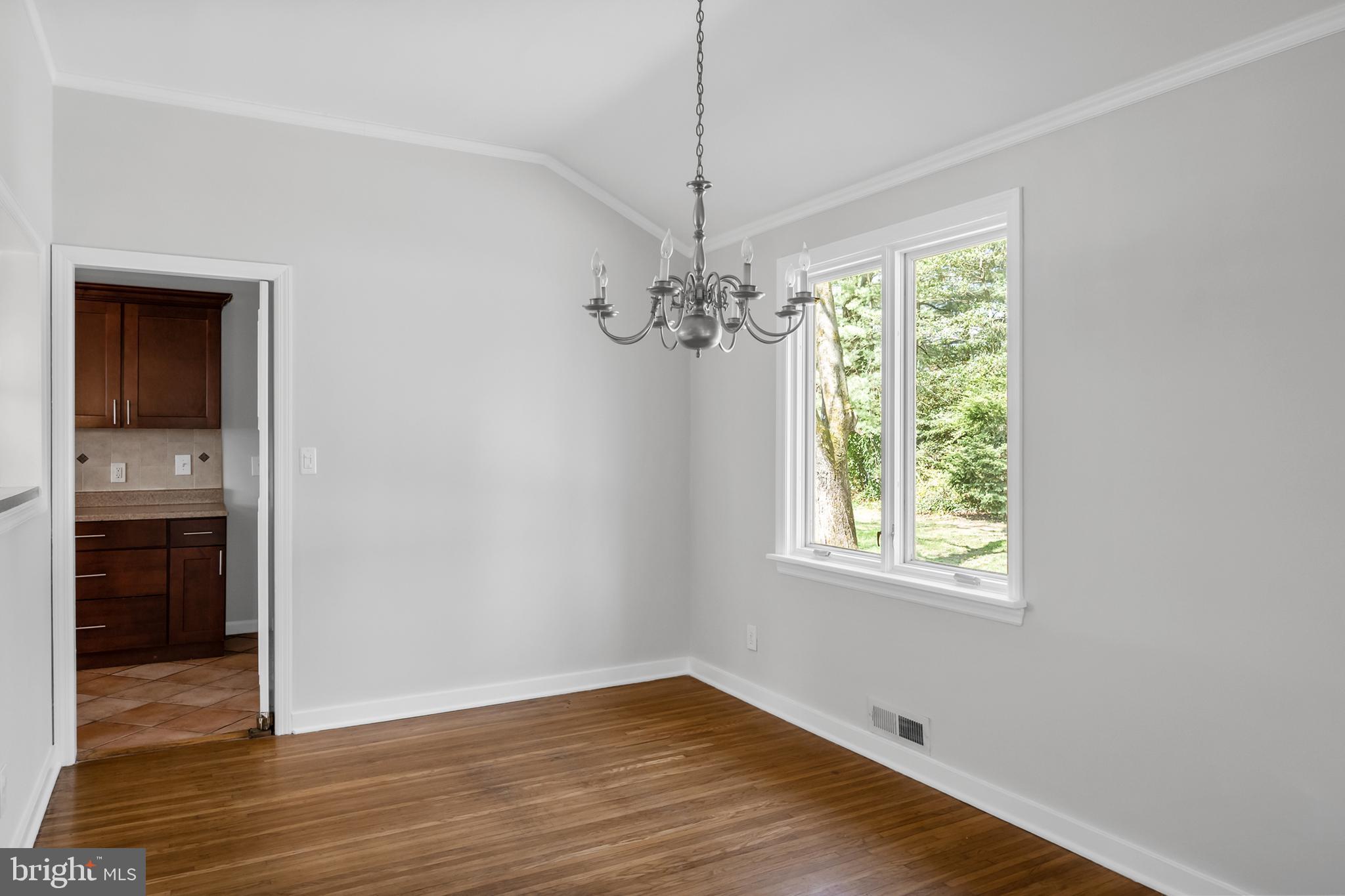 104 Sharrowvale Road Cherry Hill, NJ 08034 - Photo 12 of 37 wooden floor in an empty room with a window