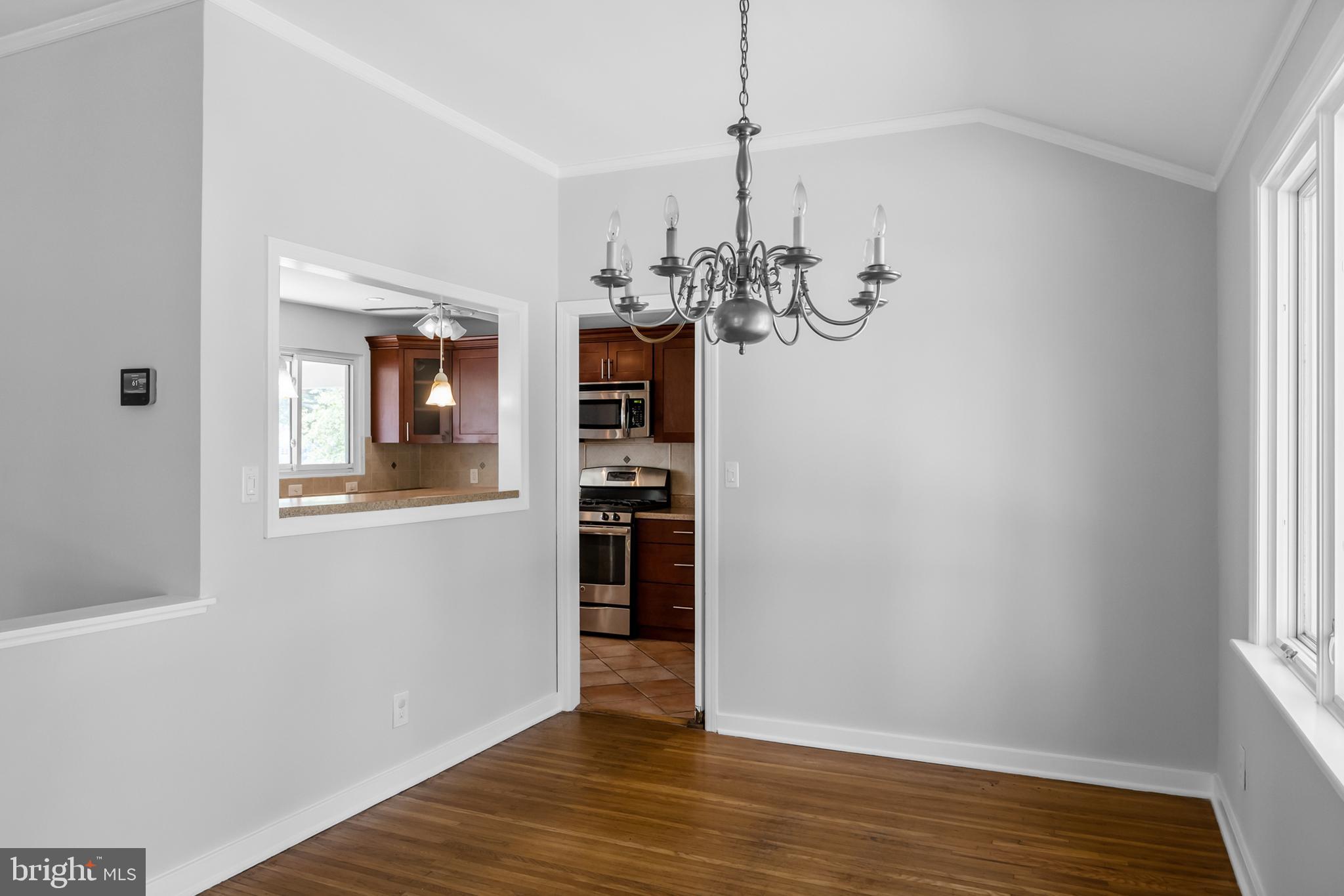 104 Sharrowvale Road Cherry Hill, NJ 08034 - Photo 13 of 37 a view of a room with wooden floor staircase and a living room