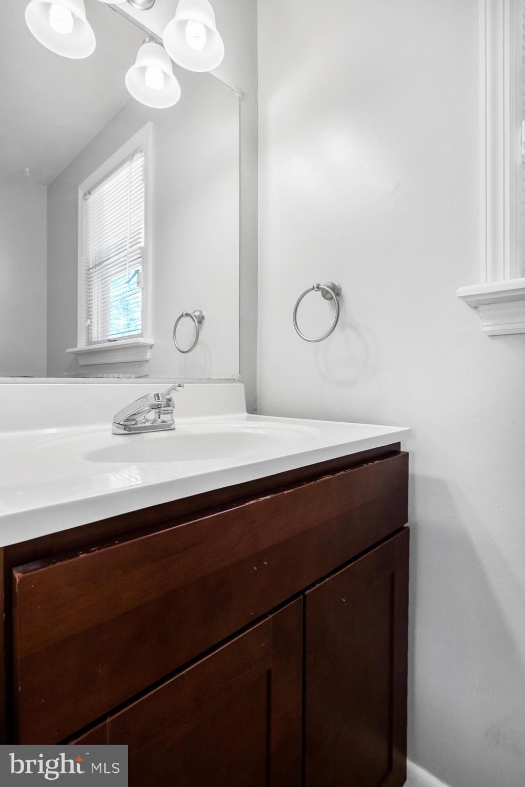 104 Sharrowvale Road Cherry Hill, NJ 08034 - Photo 20 of 37 a bathroom with a sink and a mirror