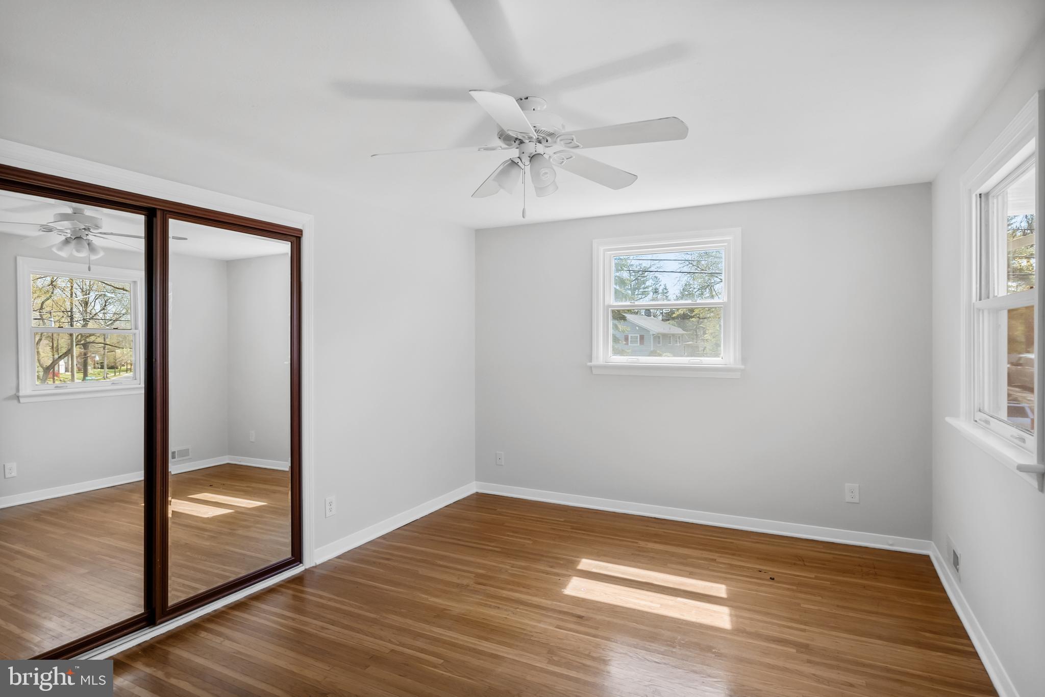 104 Sharrowvale Road Cherry Hill, NJ 08034 - Photo 21 of 37 wooden floor in an empty room with a window