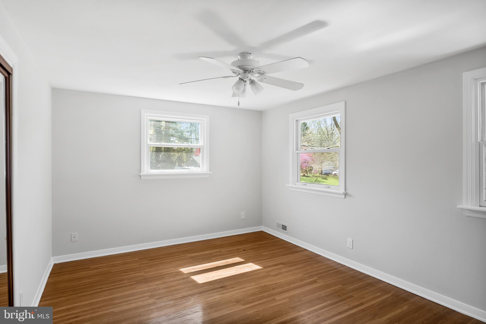 104 Sharrowvale Road Cherry Hill, NJ 08034 - Photo 22 of 37 wooden floor in an empty room with a window