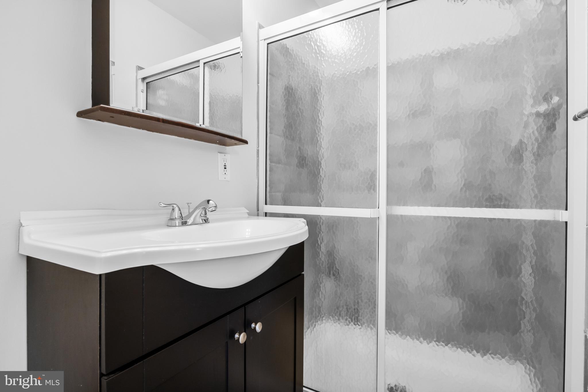 104 Sharrowvale Road Cherry Hill, NJ 08034 - Photo 23 of 37 a bathroom with a sink and a mirror