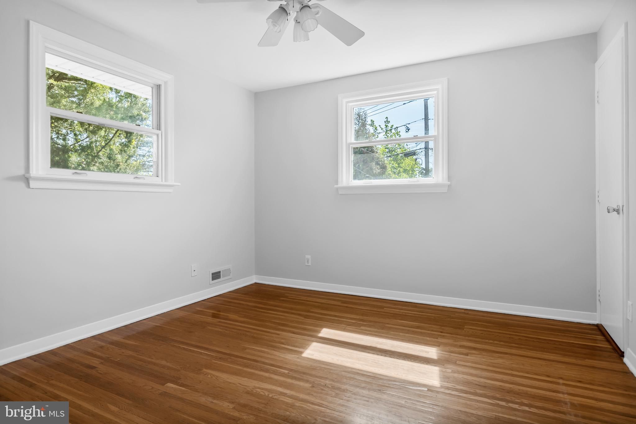 104 Sharrowvale Road Cherry Hill, NJ 08034 - Photo 24 of 37 a view of empty room with wooden floor and fan