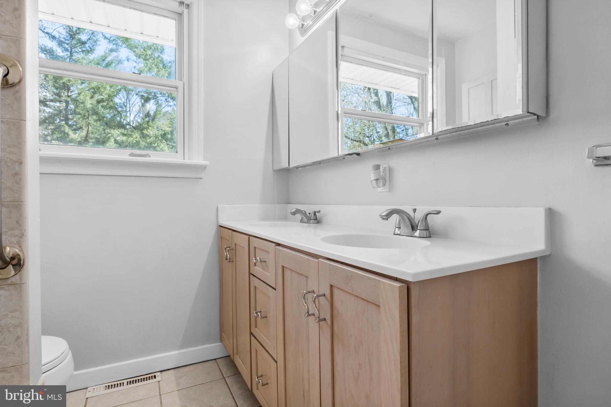 104 Sharrowvale Road Cherry Hill, NJ 08034 - Photo 27 of 37 a bathroom with a sink and a window