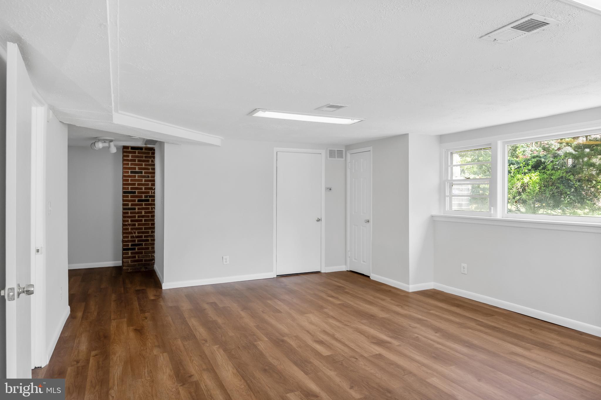 104 Sharrowvale Road Cherry Hill, NJ 08034 - Photo 31 of 37 a view of empty room with wooden floor and fan