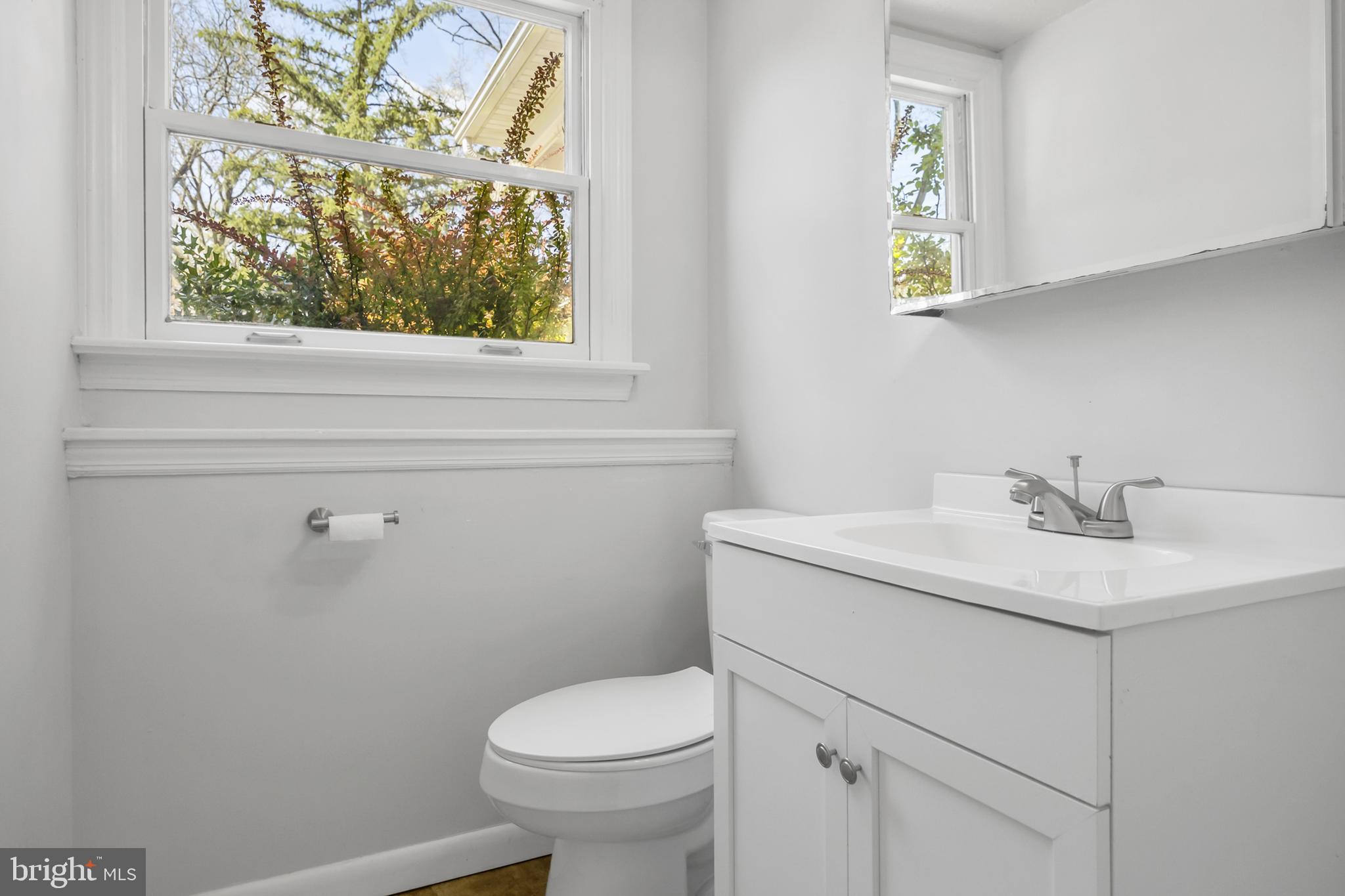 104 Sharrowvale Road Cherry Hill, NJ 08034 - Photo 33 of 37 a bathroom with a sink mirror vanity and toilet
