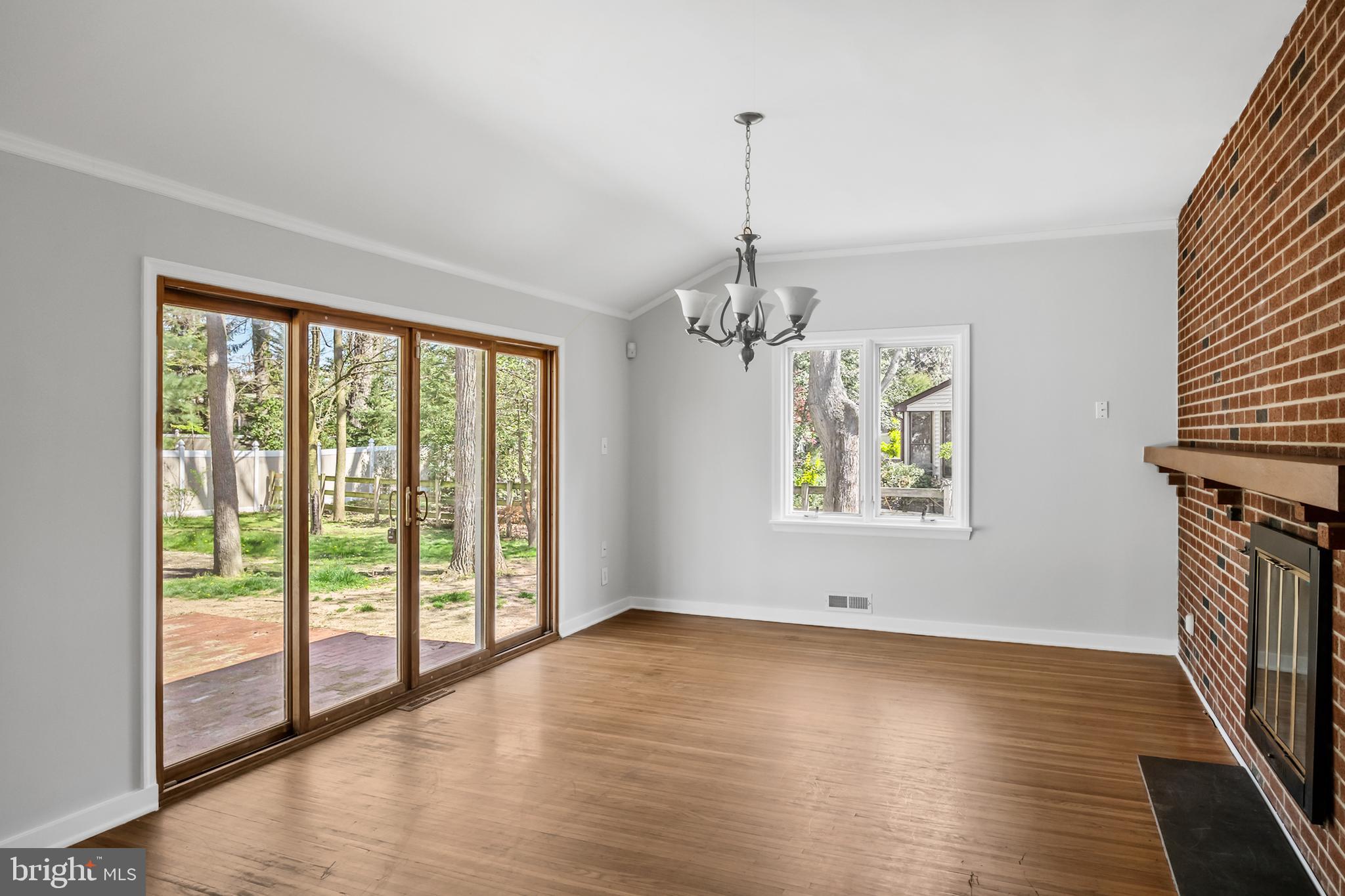 104 Sharrowvale Road Cherry Hill, NJ 08034 - Photo 6 of 37 a view of an empty room with wooden floor and a window