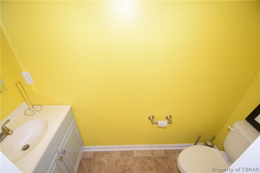 561 Possum Point Road Port Haywood, VA 23138 - Photo 10 of 23 a bathroom with a sink and a toilet