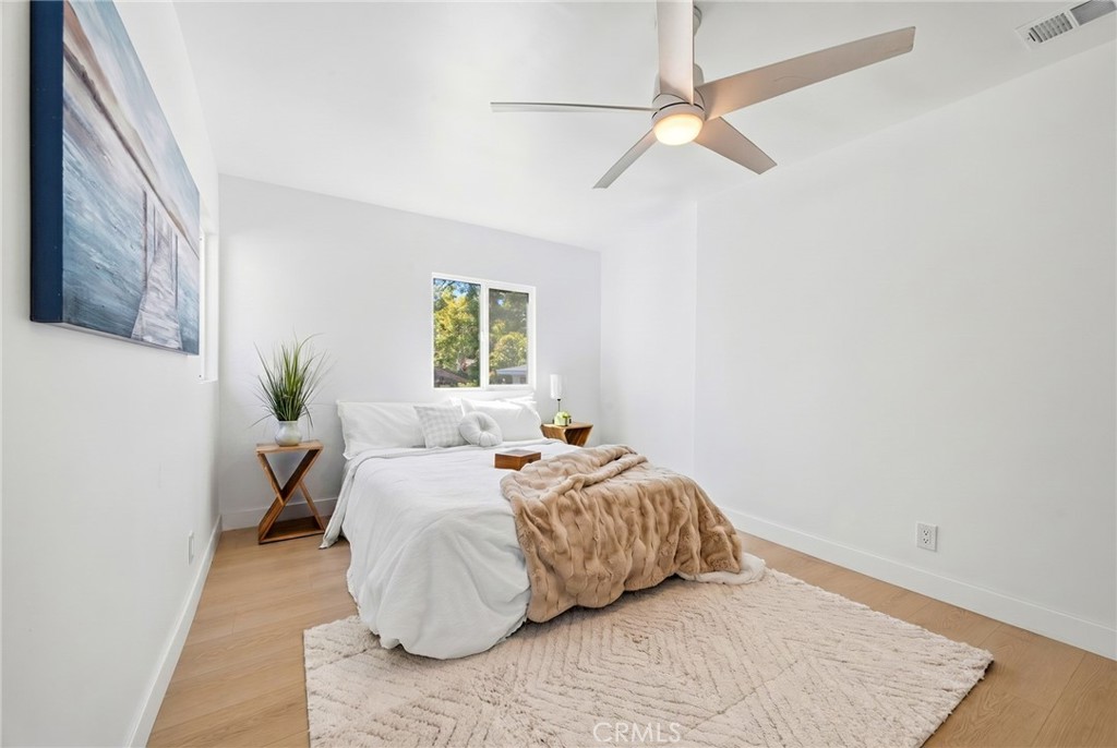 1280 East Woodbury Road Pasadena, CA 91104 - Photo 24 of 40 a bedroom with a bed and a window