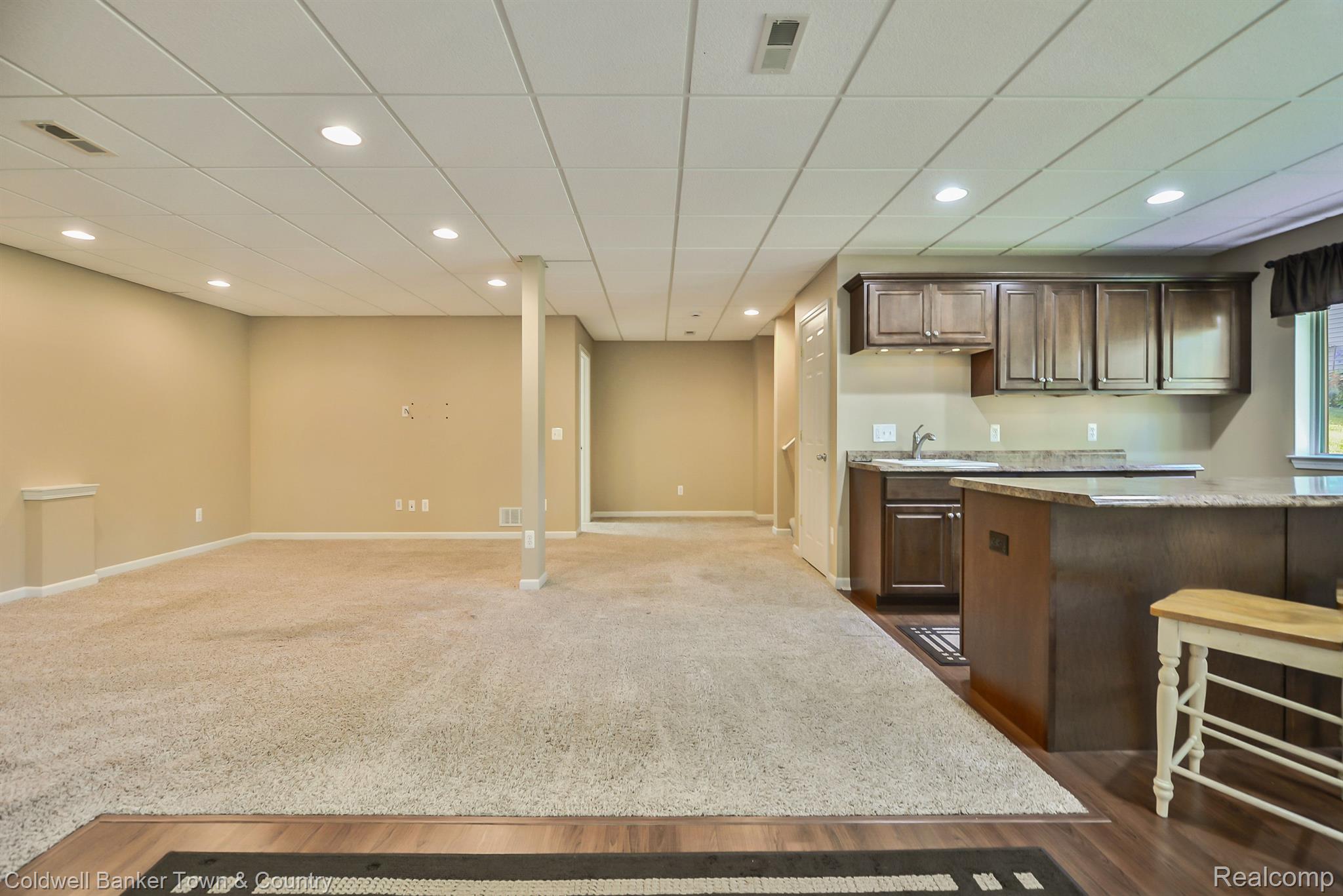 213 Slider Avenue Howell, MI 48843 - Photo 60 of 64 Lower level kitchen and family room