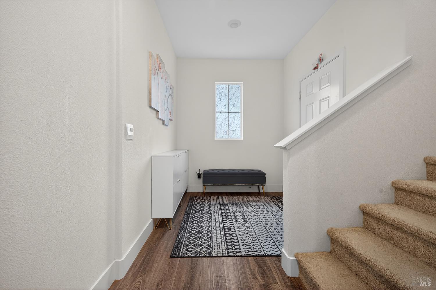6042 Oxford Place Rohnert Park, CA 94928 - Photo 11 of 31 a bedroom with wooden floor and a rug