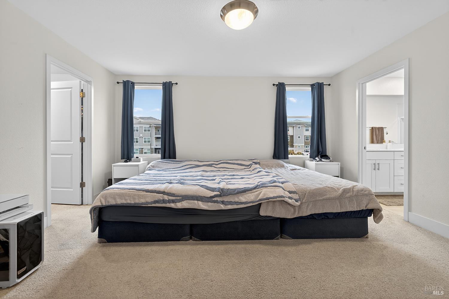 6042 Oxford Place Rohnert Park, CA 94928 - Photo 12 of 31 a bedroom with a bed lamp and a fireplace